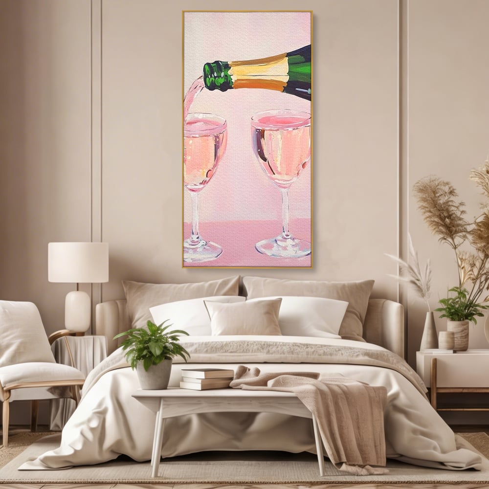 Tablou canvas cu pictura cu sticla si pahare de sampanie roz, in rama de aluminiu auriu, pe perete intr-un dormitor